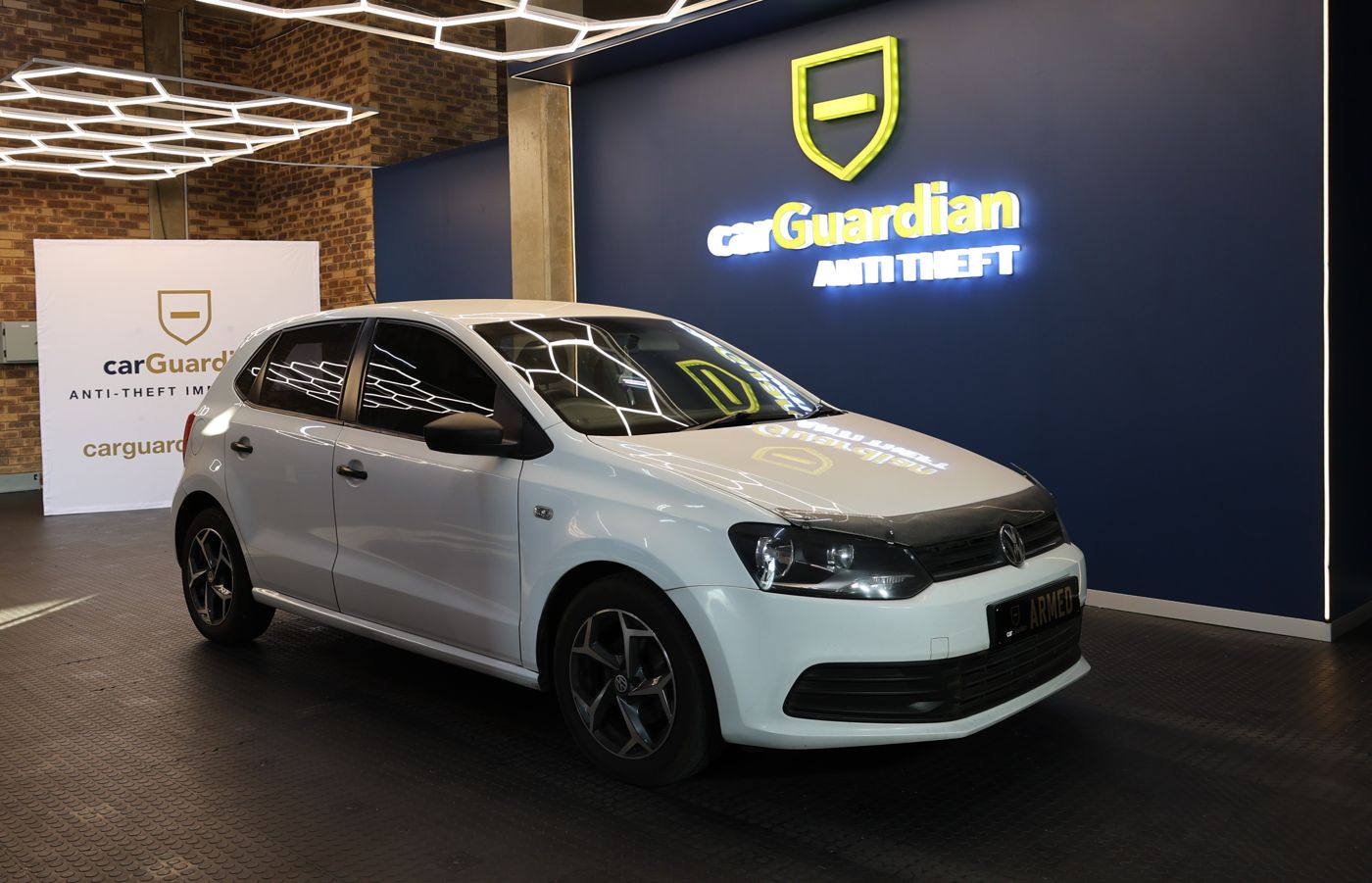 VW Polo Vivo with carGuardian fitted, ARMED plate showing, in the carGuardian showroom